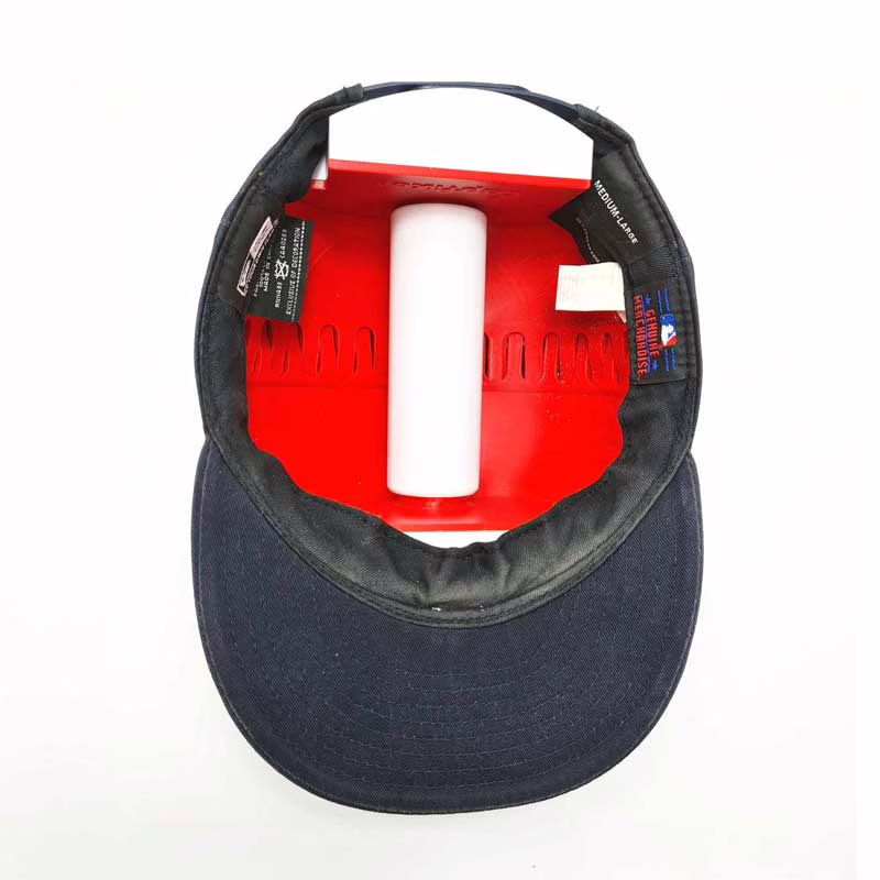 Inside view of a baseball cap stretched on the Capfixer.